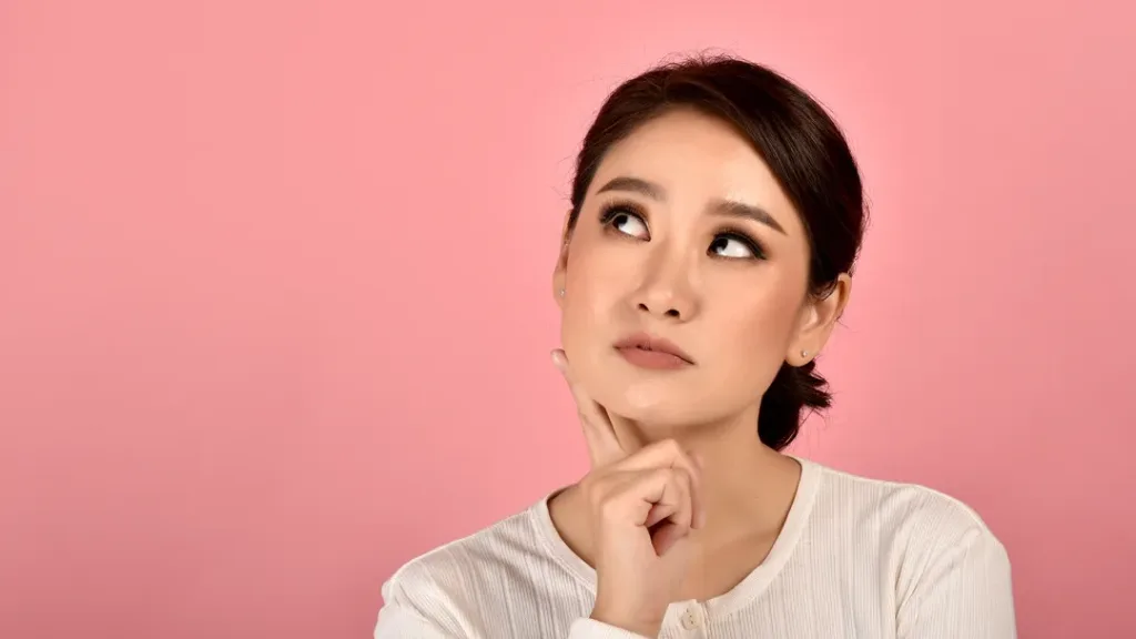 woman thinking about laser hair removal 